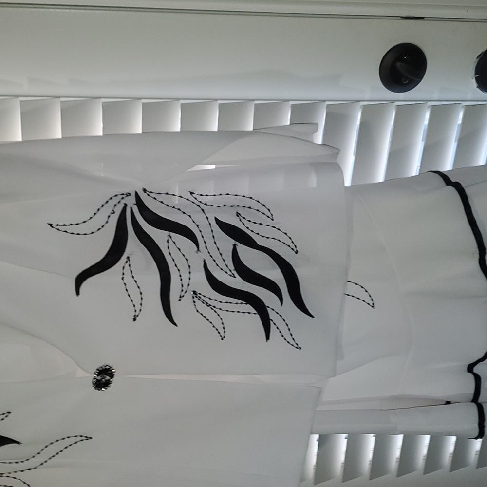 White and black Tally Taylor 3 piece woman's suit.